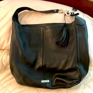 Black Leather, Used but in good shape.